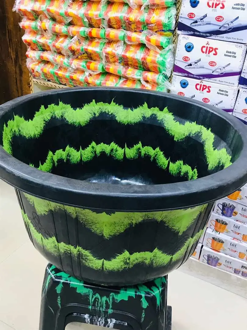 Black and green wave pattern plastic basin moulded in two colours