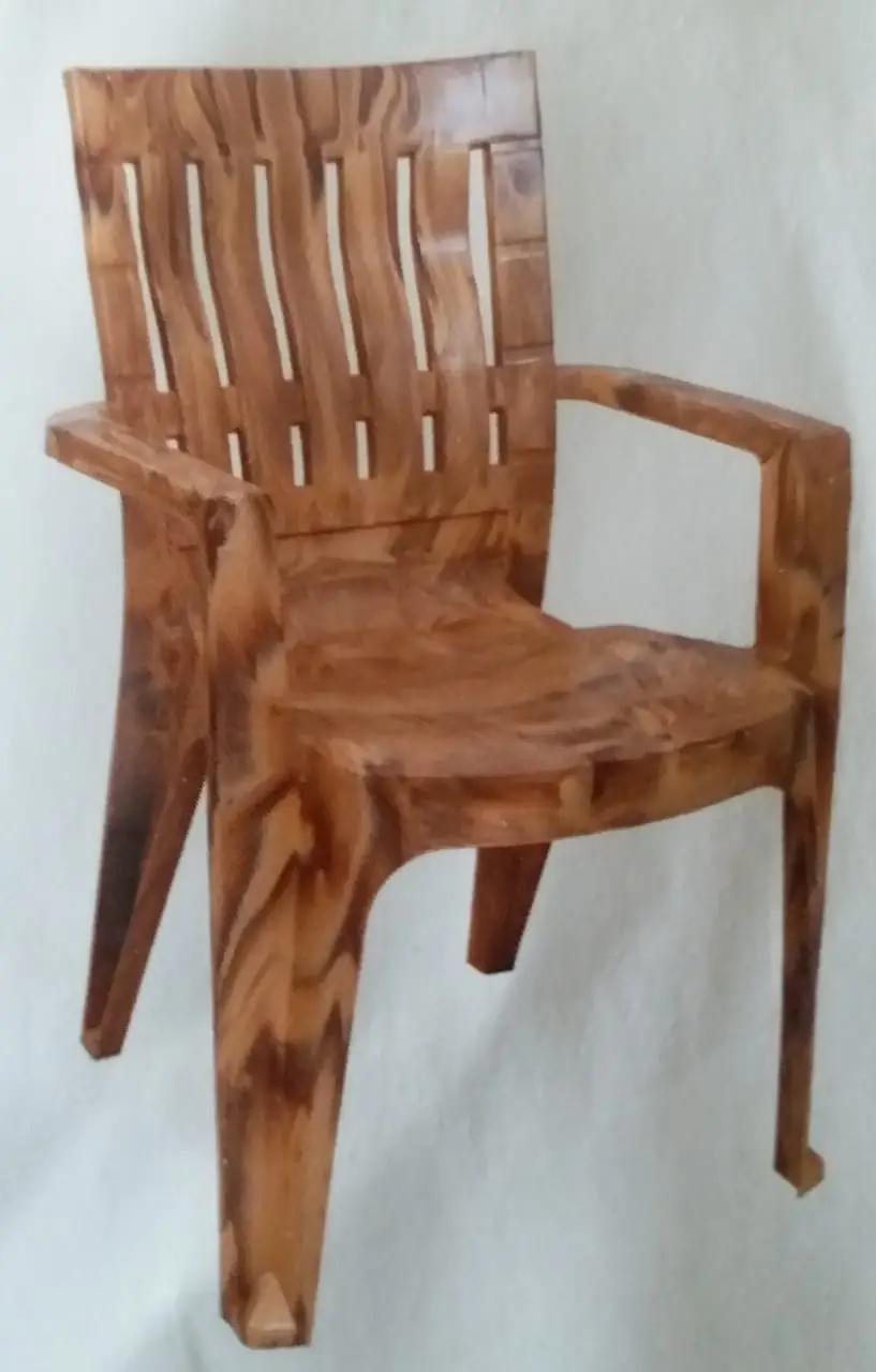Wooden effect plastic chair moulded with a two colour attachment