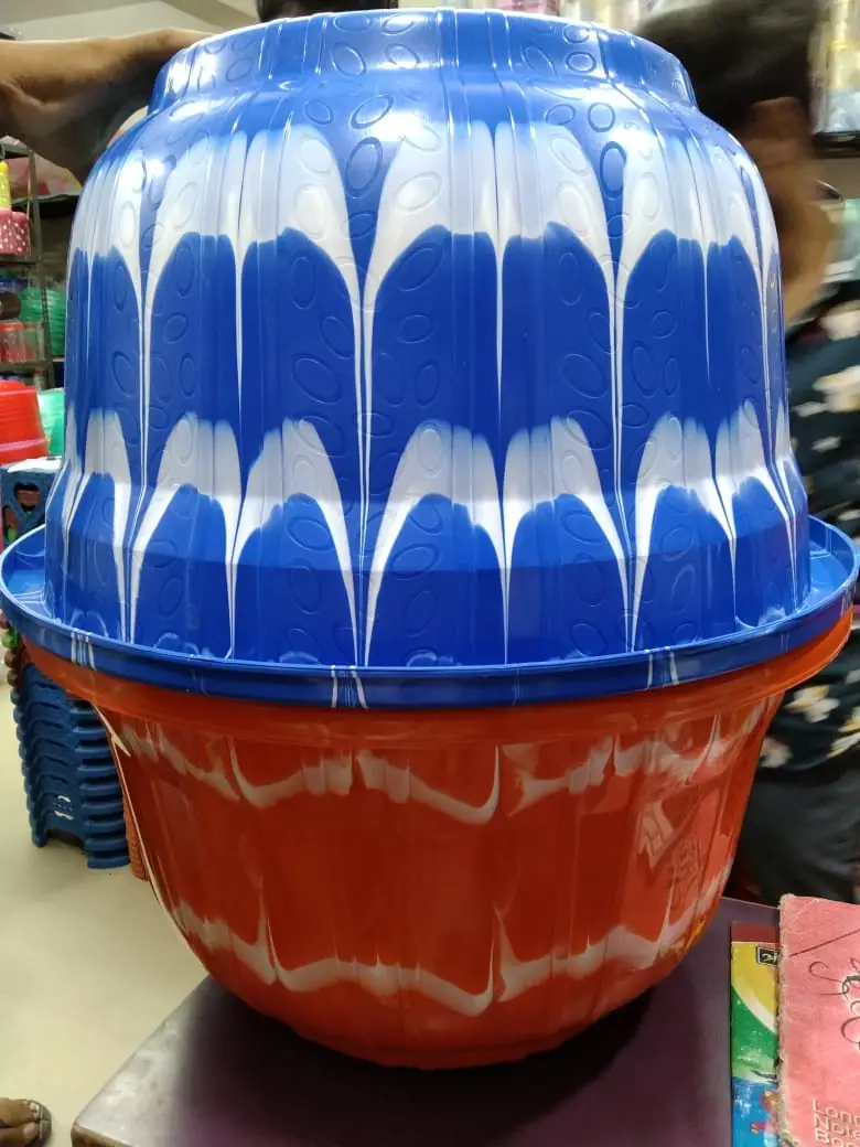 Blue and orange two colour plastic tub made on an injection moulding machine with a double colour attachment